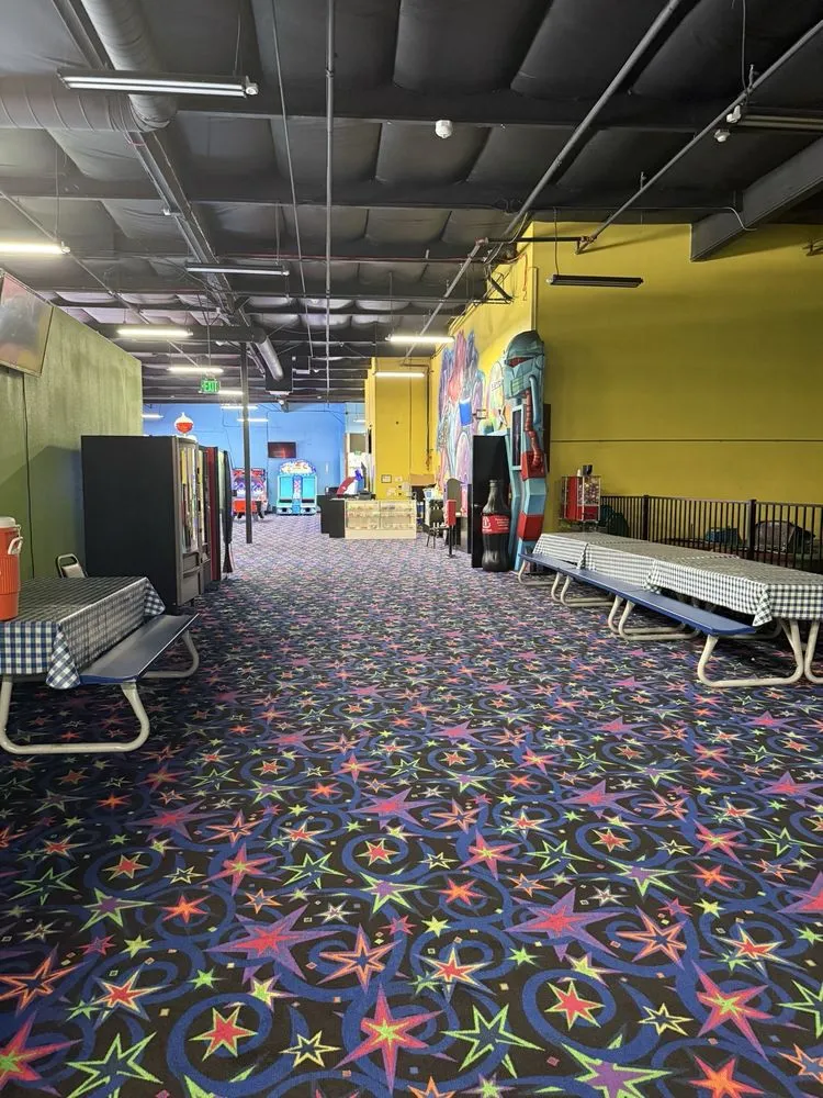 Arcade party room area with star carpet at SacTag in Sacramento CA.