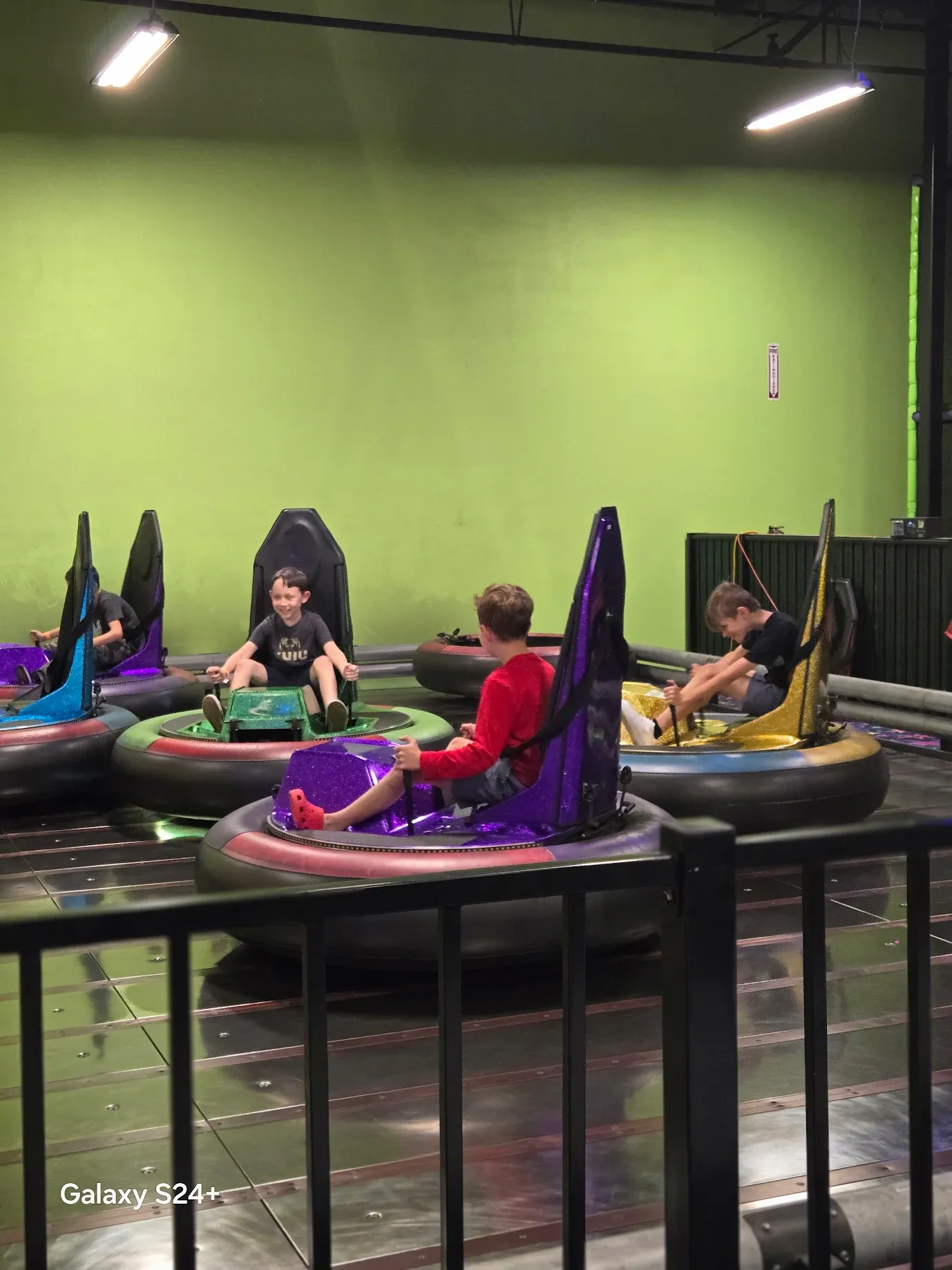 Kids on indoor bumper cars at SacTag